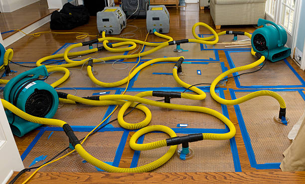 Professional Flood Damage Restoration technician working in Caratunk, ME